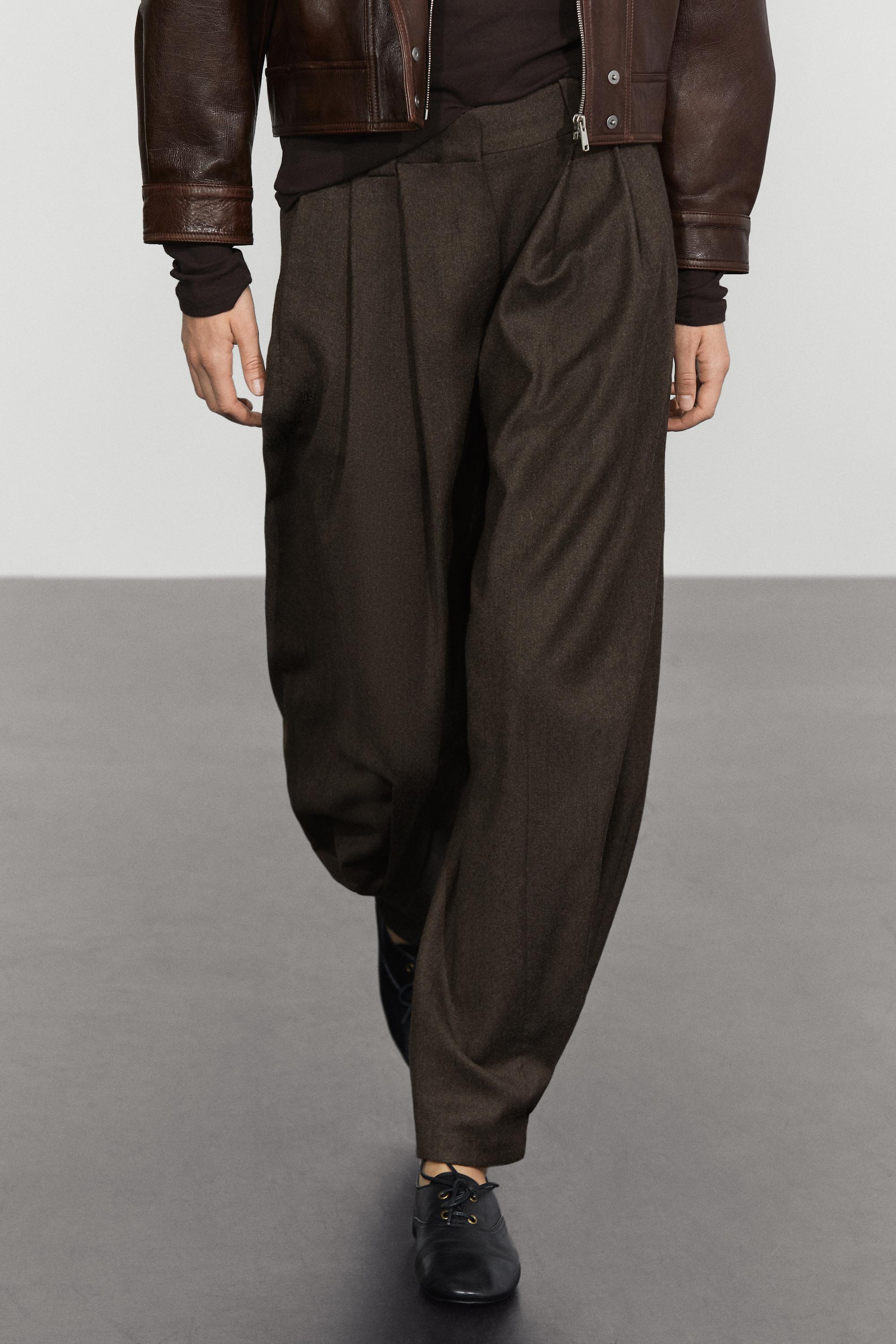 Pleated flannel trousers with hem detail